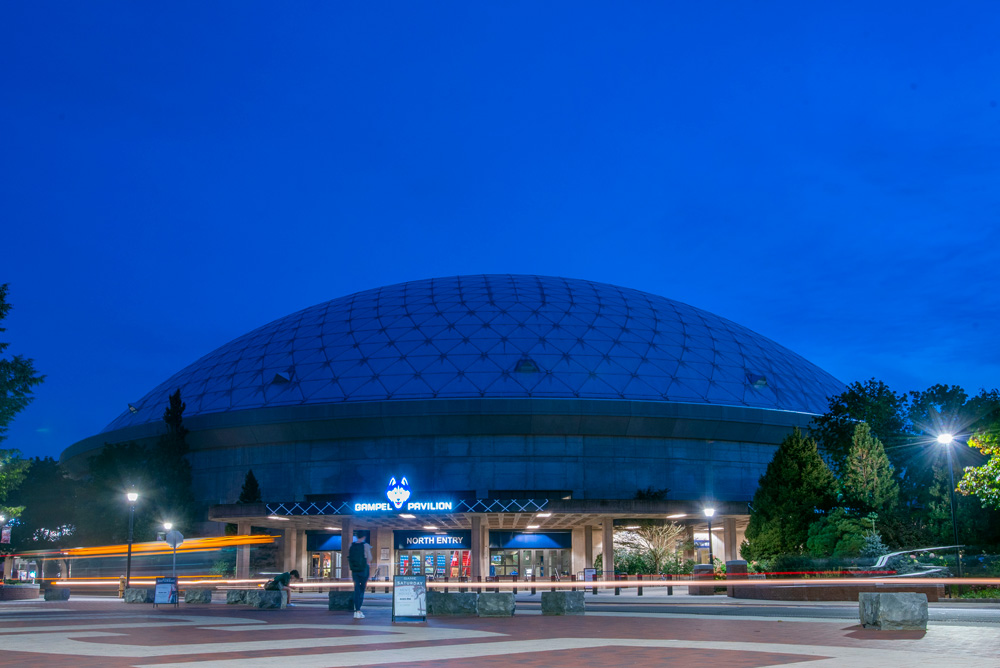 Gampel Pavillion at night with dark blue sky